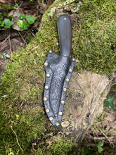 Refined double edged Corsair knife with abstract feather etching and African Blackwood handle